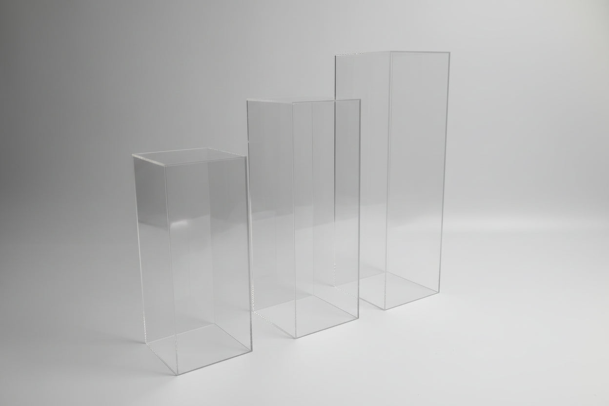 Modern transparent acrylic plinth display stands with square tops for gallery, retail and event decor